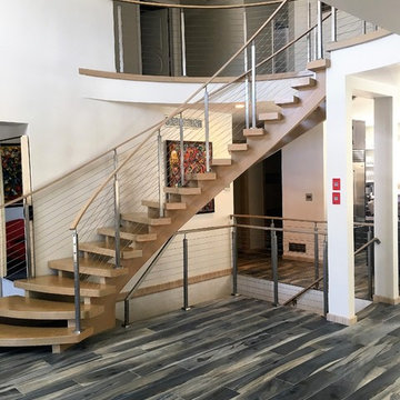 Nina - custom curved staircase and cable railing