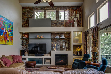 Contemporary open concept family room in Denver with beige walls, dark hardwood floors, a standard fireplace, a stone fireplace surround and a built-in media wall.