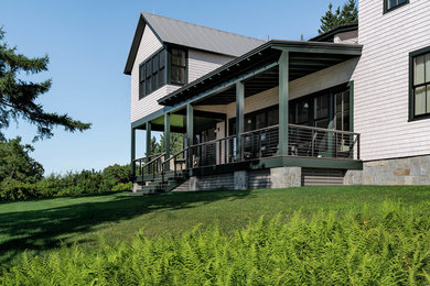 Deck - mid-sized coastal backyard deck idea in Portland Maine with a roof extension