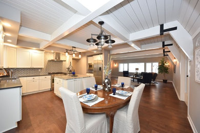 Mid-sized elegant dark wood floor and brown floor kitchen/dining room combo photo in Milwaukee with gray walls and no fireplace
