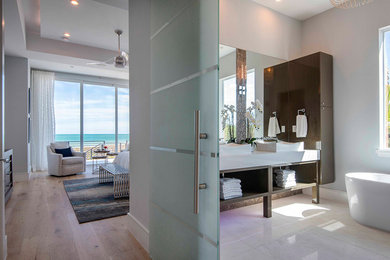 Inspiration for a contemporary beige tile double-sink freestanding bathtub remodel in Orlando with open cabinets, brown cabinets, quartzite countertops, white countertops and a freestanding vanity