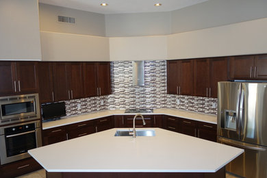 Example of a minimalist kitchen design in Phoenix with an undermount sink and stainless steel appliances