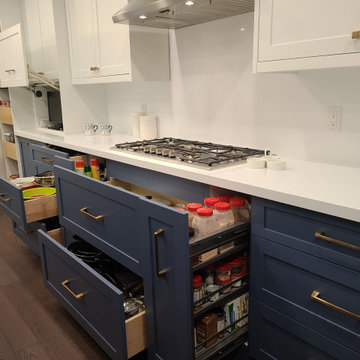 Two tone white and blue modern kitchen design.