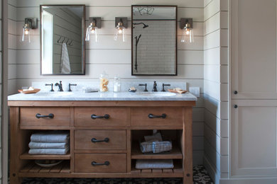 Design ideas for a mid-sized country master bathroom in Burlington with open cabinets, medium wood cabinets, an alcove tub, an alcove shower, a one-piece toilet, grey walls, ceramic floors, an undermount sink, marble benchtops, black floor and a shower curtain.