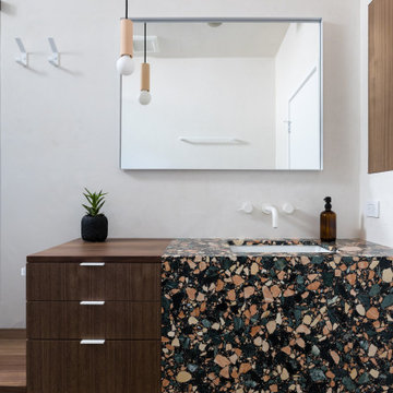 Bathroom with bold multicolor large-aggregate terrazzo - Fold House