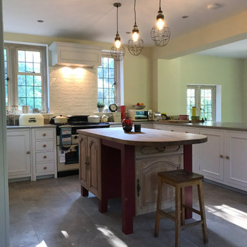 Traditional, bright kitchen with upcycled island