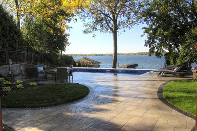 Small elegant backyard concrete paver patio photo in Milwaukee