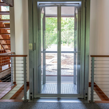 Boxborough Deck House with Modern Home Elevator