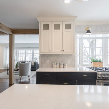 Antique White Oak Box Beams Framing a Kitchen Transition
