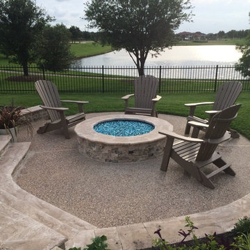 Travertine Firepit by pool overlooking lake