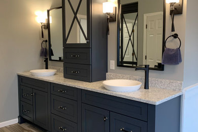 Example of a large transitional master gray tile ceramic tile, beige floor, double-sink and vaulted ceiling bathroom design in Other with recessed-panel cabinets, blue cabinets, gray walls, a vessel sink, quartzite countertops, gray countertops and a built-in vanity