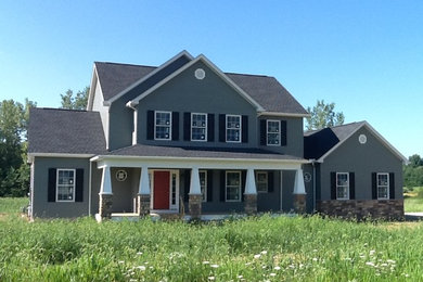 Photo of an arts and crafts two-storey grey exterior in Columbus with vinyl siding and a gable roof.