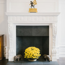 fireplace - big black vase were flowers are