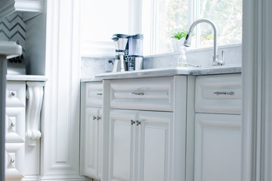 Inspiration for a large timeless u-shaped medium tone wood floor and brown floor eat-in kitchen remodel in Toronto with a farmhouse sink, raised-panel cabinets, white cabinets, quartz countertops, white backsplash, stone tile backsplash, stainless steel appliances and an island