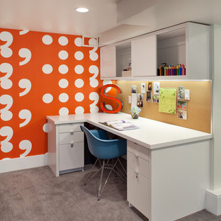 Contemporary home office in Portland with orange walls, carpet and a built-in desk.