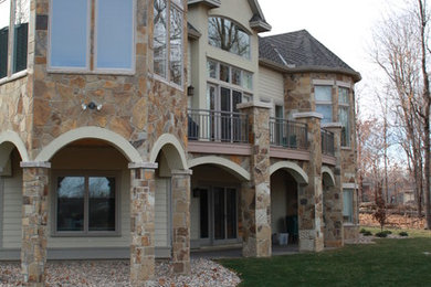 Inspiration for a huge transitional beige one-story concrete fiberboard exterior home remodel in Minneapolis