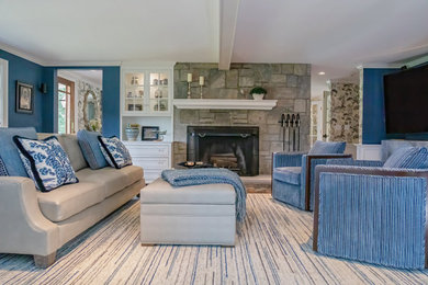 Example of a mid-sized beach style formal and open concept carpeted, blue floor and exposed beam living room design in Bridgeport with blue walls, a standard fireplace, a stone fireplace and a media wall