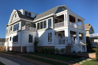 Coastal gray wood exterior home idea in Philadelphia with a gambrel roof