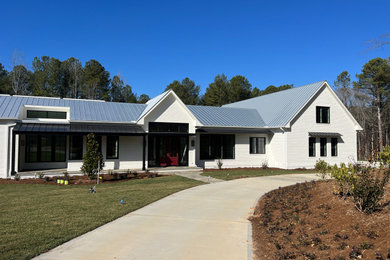Example of a cottage exterior home design in Raleigh