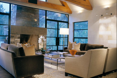 Inspiration for a large modern open concept dark wood floor living room remodel in Denver with white walls, a standard fireplace and a stone fireplace