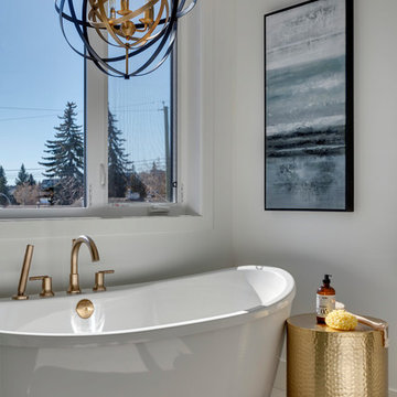 Massive Tub with Beautiful Light Fixture Above
