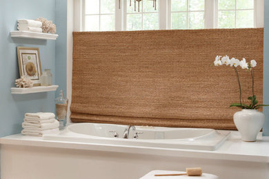 Inspiration for a mid-sized transitional master marble floor and gray floor drop-in bathtub remodel in Grand Rapids with blue walls