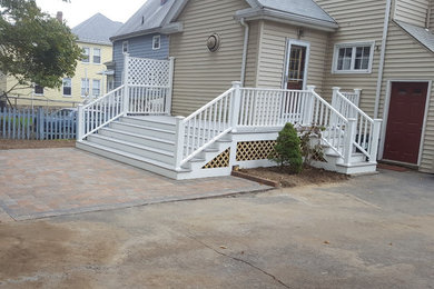Example of a small classic backyard brick patio design in Boston with no cover