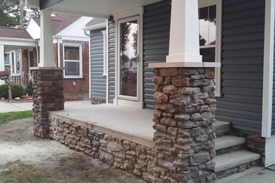 Inspiration for a contemporary blue one-story vinyl gable roof remodel in Detroit