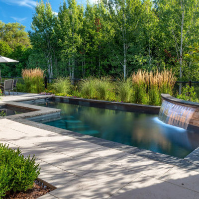 Pool landscaping - small transitional backyard stamped concrete and rectangular pool landscaping idea in Toronto