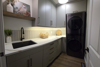 Transitional laundry room photo in Edmonton