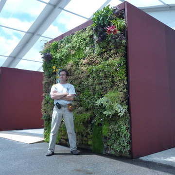 Pietro poses in front of the vertical garden.