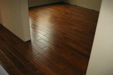 Example of a medium tone wood floor bedroom design in Austin