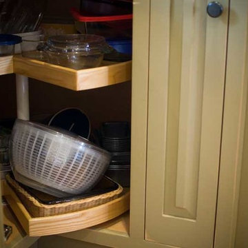 Corner base cabinet with independently rotating shelves.