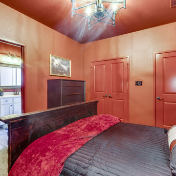Bold Southwestern Bedroom with Carved Wood Bed