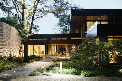 Example of a large trendy gray two-story mixed siding exterior home design in Chicago