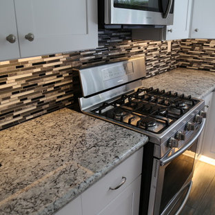 Kitchen Remodel with White Shaker Style Cabinets and Granite
