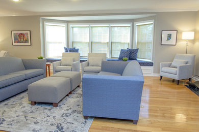 Example of a large transitional formal and enclosed light wood floor living room design in Cincinnati with gray walls, a standard fireplace, a brick fireplace and a tv stand