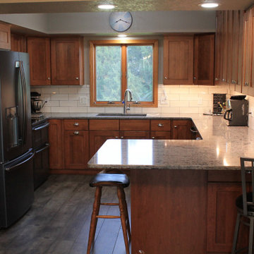 Omega Cabinetry, Benson door, Cherry wood, Nutmeg stain.
