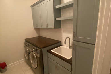 Inspiration for a mid-sized french country laundry room remodel in Jacksonville