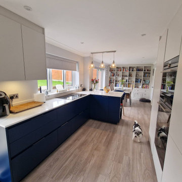 A contemporary kitchen with a functional cooking and entertainment space