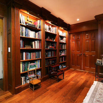 Custom library bookcases with hidden compartments