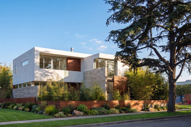 Inspiration for a large modern white three-story wood exterior home remodel