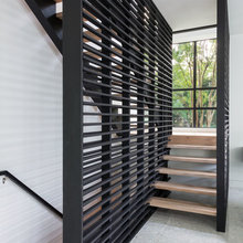 Glass at end of dining room and see stairs