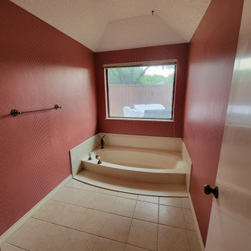 Two separate bathrooms converted into a master bathroom with a big open closet
