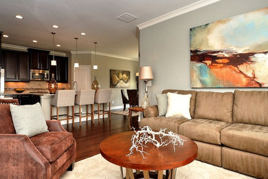 Mid-sized transitional open concept dark wood floor family room photo in Atlanta with a standard fireplace, a stone fireplace, a wall-mounted tv and blue walls