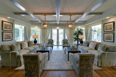 Large transitional formal and open concept medium tone wood floor living room photo in Miami with gray walls, no fireplace and no tv