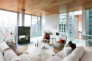 Minimalist living room photo in Other with white walls