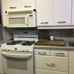 Slanted Cabinets | White Grain Textured Cabinetry - Kitchen Cabinetry