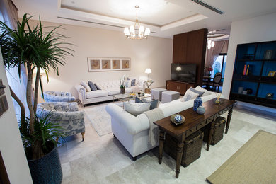 Inspiration for a mid-sized contemporary open concept marble floor living room remodel in Other with beige walls and a media wall