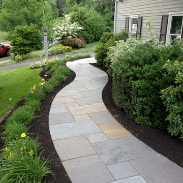 Curving Bluestone Walkway with Radius Granite Steps